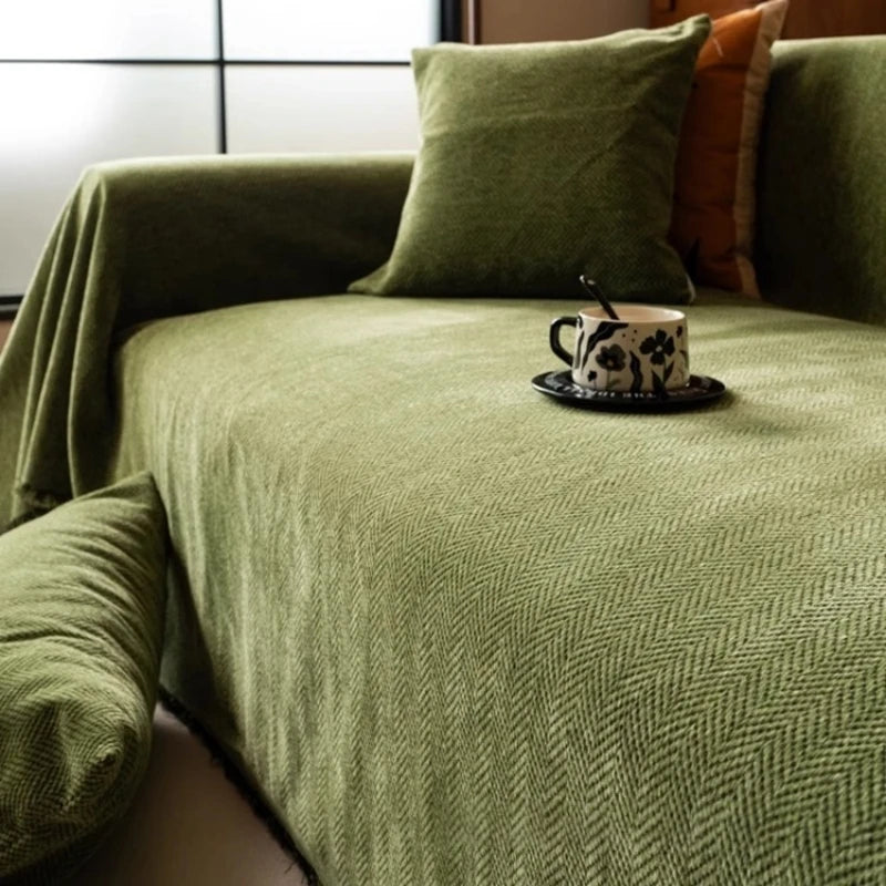 Draped cover smoothed across the sofa seat